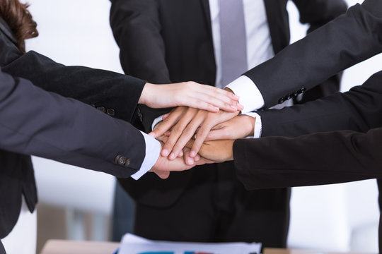 Business teamwork concept hands stack join together