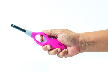 pink lighter in hand on white background isolate