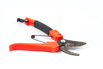 old scissors for cut branches in hand on white background