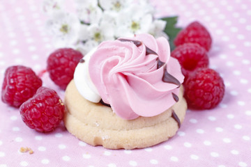 Pink raspberry cookie on dotted table cloth