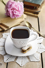 Cup of coffee on wooden table.