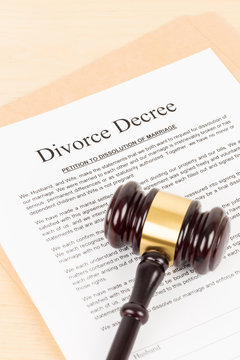 Wooden judge gavel and divorce decree; document is mock-up