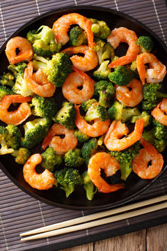 Stir fry with shrimp,  broccoli and garlic  - Chinese food. closeup. Vertical top view