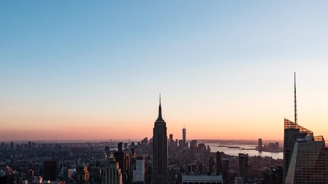 Magic hour time lapse video of Manhattan skyscrapers in New York, USA (with zoom out)