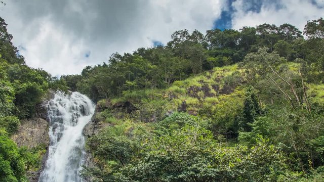 Sarika waterfall, Nakhon Nayok, Thailand. the grand waterfall in thailand with green forest and cloudy sky.
