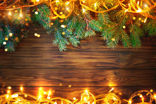 Christmas background, a table decorated with Christmas garland and fir branches With New Year and Christmas.