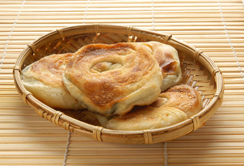Green onion pancakes are a fried Chinese flatbread often eaten as a snack or with a meal. 