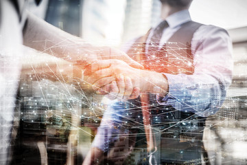 Two business people shaking hands.Successful business people handshaking closing a deal.Agreement...