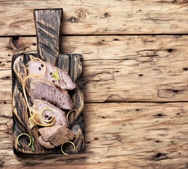 schnitzel on kitchen cutting board