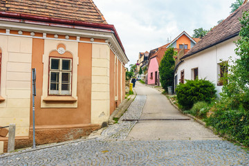The town of Hluboka nad Vltavou. Medieval town.  Narrow streets. Red tiled roofs of houses
