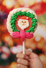 Christmas lollipop  against light background