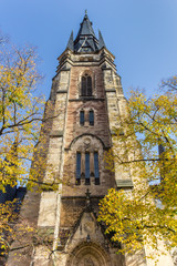 Fototapeta na wymiar Fall colors and church tower in Wernigerode
