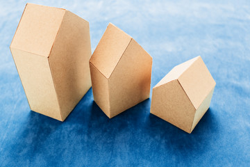 house concept with house paper model on texture background