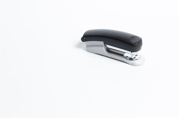 Black and white isolated metal stapler isolated background