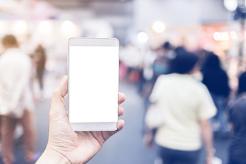 hand and screen smartphone with blur shopping mall background business concept