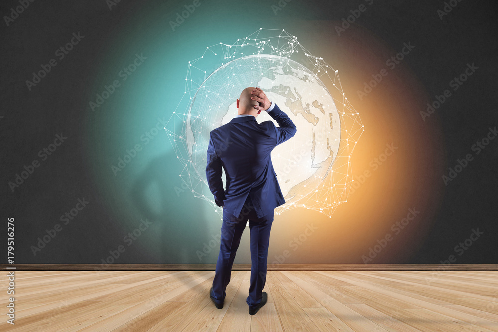 Poster businessman in front of a wall with international network displayed on a futuristic interface with g