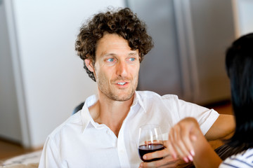Portrait of a couple having a glass of red wine