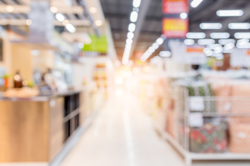 blur background image of shopping mall or department store with bokeh and people background usage...
