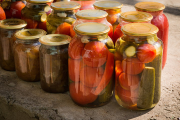 Jars with variety of pickled vegetables. Preservation