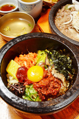 Korean beef bibimbap in hot stone bowl.    