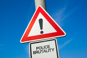 Police brutality - traffic sign with exclamation mark to alert, warn caution - precaution and...