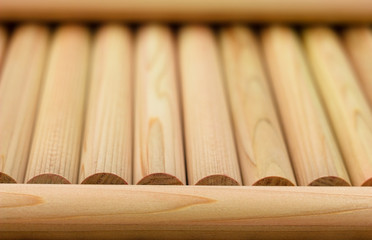 Wooden round beams, round logs, building material for the construction of a wooden house, log cabin.