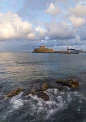 Obraz premium Agios Nikolaos fortress on the Mandraki harbour of Rhodes Greece