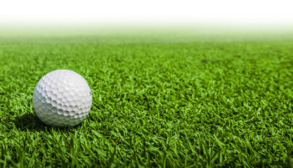 Golf ball on green grass
