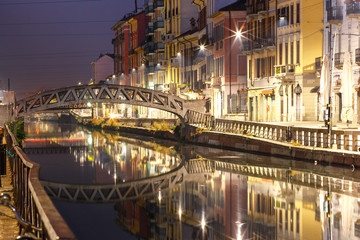 Bridge across the Naviglio Grande canal at night, Milan, Lombardia, Italy