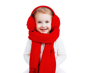 Beautiful little girl with earphones in red on a white background, isolated