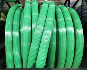 Obraz premium green garden water hose