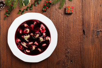 Traditional, Polish Christmas red borsch with dumplings.