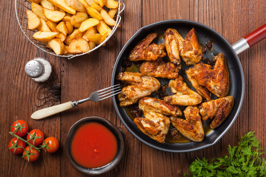 Baked wings, served with dip or baked potatoes.