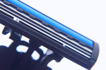 Obraz premium Close Up Of Shaving Razor Blade Over White Background