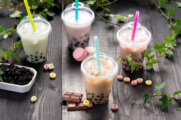 Milky bubble tea with tapioca pearls in plastic cup