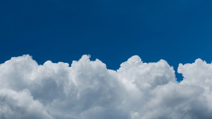 Naklejka na ściany i meble Closeup cumulus cloud with blue sky