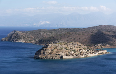 Fototapeta na wymiar Overview of Spinalonga Island the historic leper colony and Venetian fortress. Lasithi, Crete Greece. October 2017