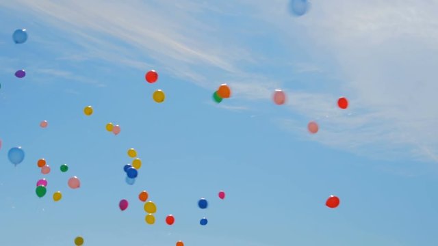 Many colorful balloons flying in the air. Celebration and birthday concept