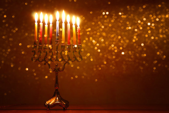 low key image of jewish holiday Hanukkah background with menorah (traditional candelabra)