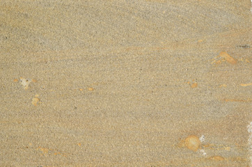 Beige color smooth stone surface as a background