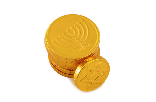 Image of jewish holiday Hanukkah with gold chocolate coins isolated on white