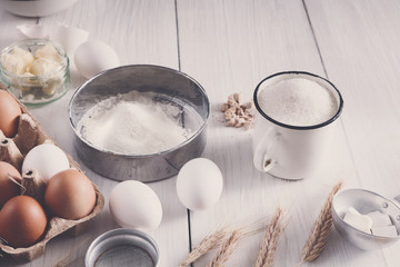 Baking ingredients on rustic white background