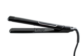 Black hair straightener isolated on white background