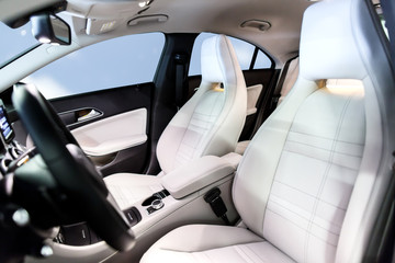Car interior luxury. Interior of prestige modern car. Leather comfortable seats, multimedia &...