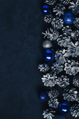 dark christmas background with cones