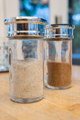 Chili and pepper in glass bottle