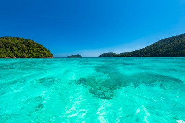 Fototapeta na wymiar Wonderful turqoise water surface at Andaman sea, Beautiful sea water surface at Surin Island, Thailand