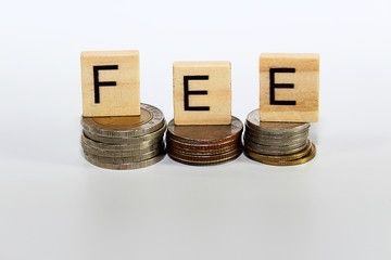 bank fees, service fee concept.Fees text stacked on coins with cool image temperature