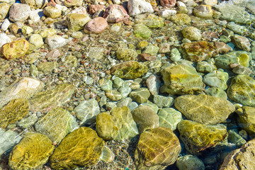 The sea view. Beautiful view from the mountain to the calm Adriatic sea. Blue clear water and large stones.