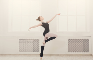Beautiful ballerina stands in ballet pirouette © Prostock-studio